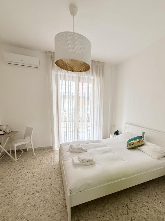 Łóżko lub łóżka w pokoju w obiekcie The Palms