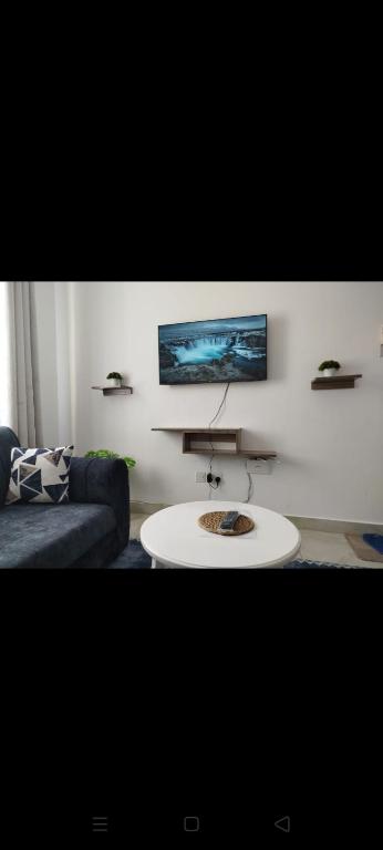 a living room with a couch and a table at Vescon 1 in Mombasa