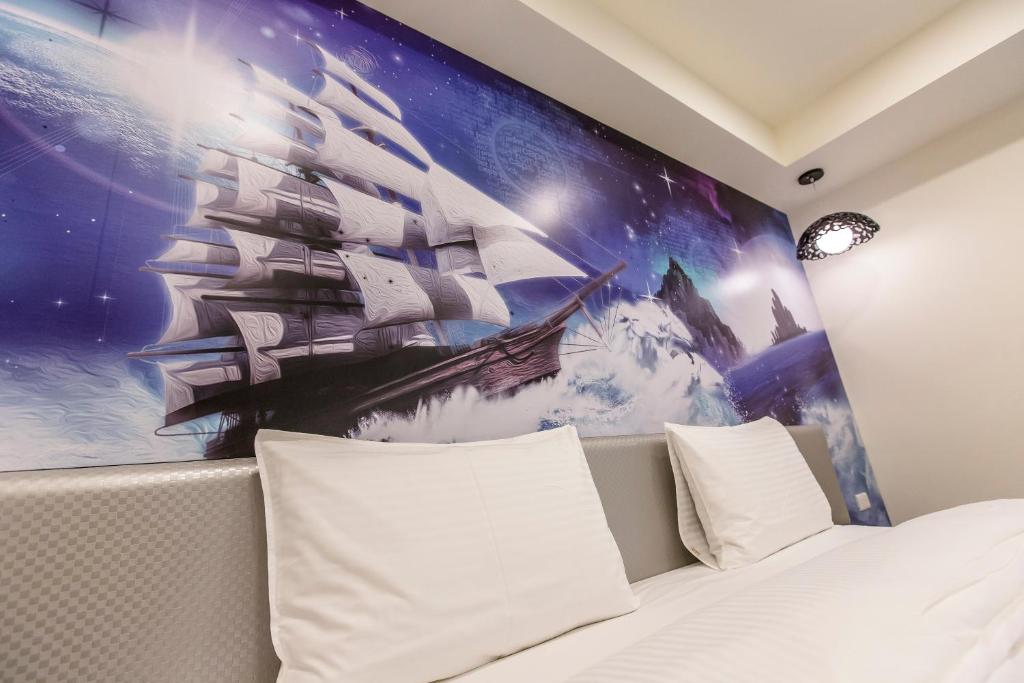 Postel nebo postele na pokoji v ubytování The Cloud Hotel Zhongli Branch