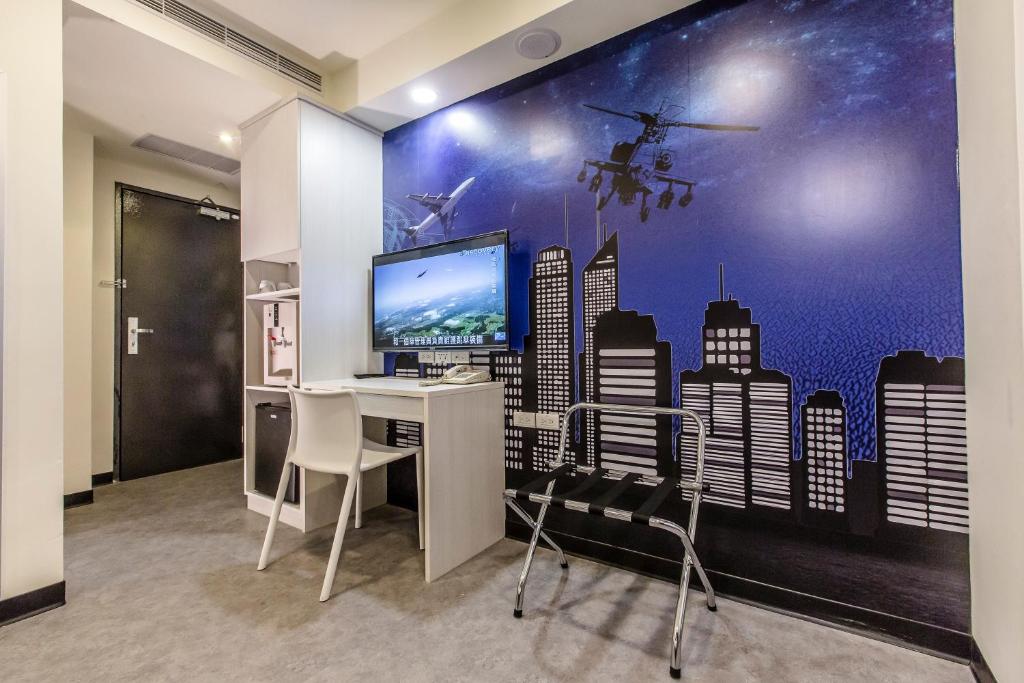 TV a/nebo společenská místnost v ubytování The Cloud Hotel Zhongli Branch