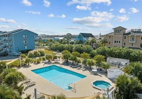 an overhead view of a swimming pool in a resort at Pearl on the Point in Carolina Beach