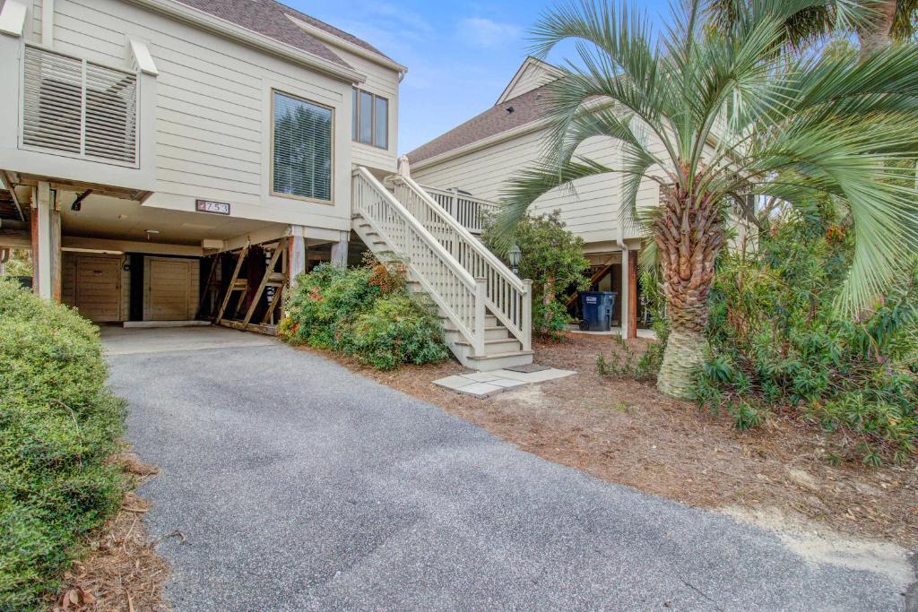 a house with a staircase leading to a driveway at Spinnaker 753 in Seabrook Island