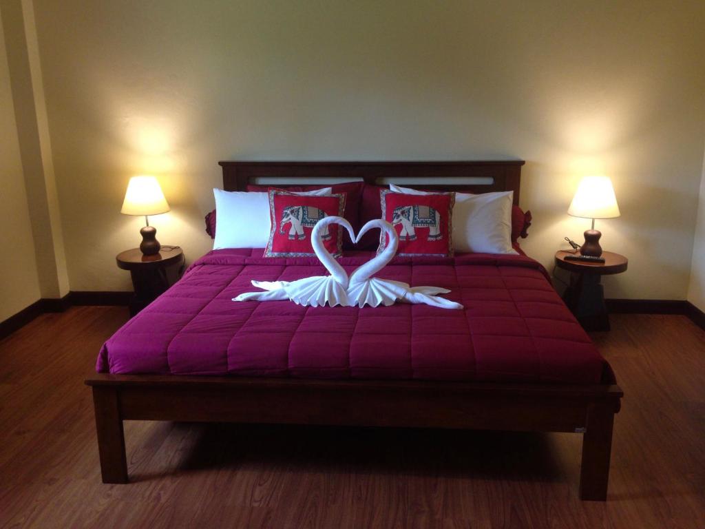 Postel nebo postele na pokoji v ubytování Garden Resort
