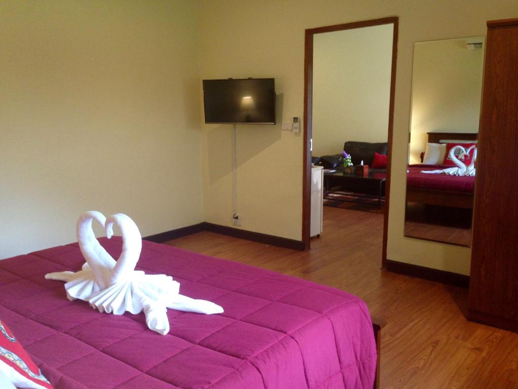 Postel nebo postele na pokoji v ubytování Garden Resort