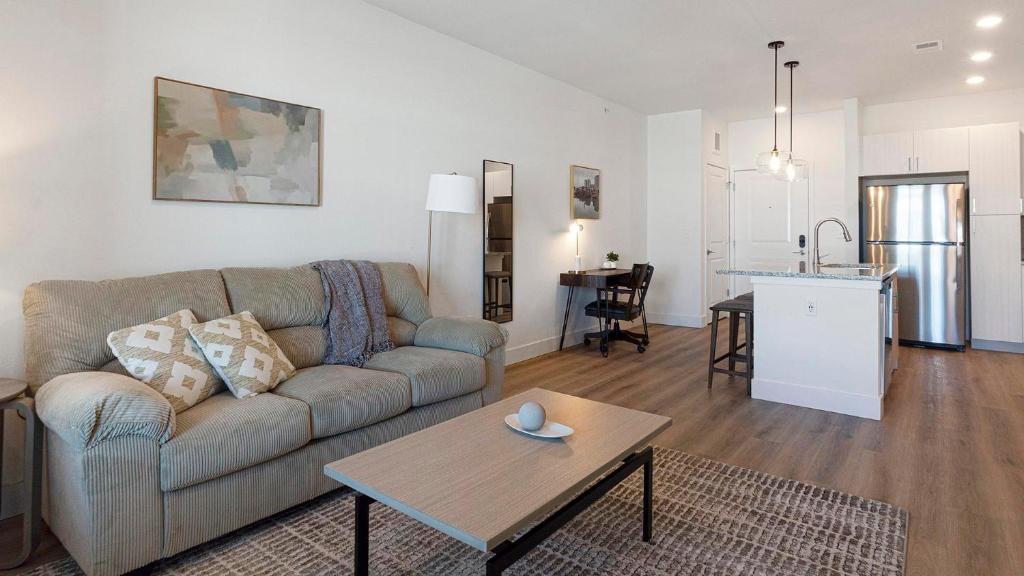a living room with a couch and a table at Landing Modern 2BD Gym Clubhouse in Longmont