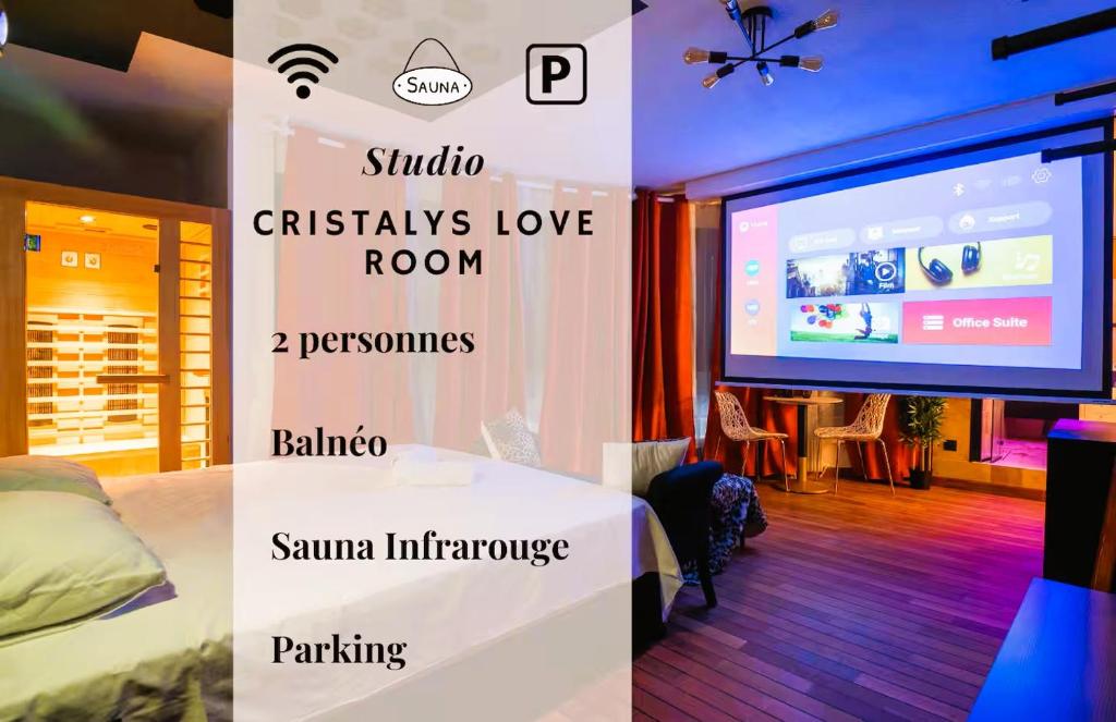 a room with a bed and a large screen at Cristalys Loveroom & Spa in Montpellier