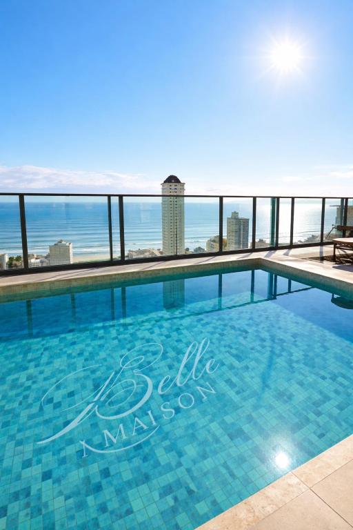 a swimming pool with a view of the ocean at Summerview novo , 2 piscinas e 2 jacuzzis, 2 quartos Novo! in Itapema