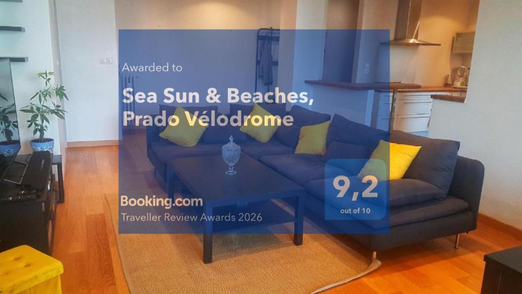 a blue couch in a living room with a table at Sea Sun & Beaches, Prado Vélodrome in Marseille