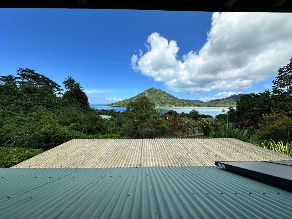 a view from the roof of a house with the ocean in the background at Vaka House in HUH