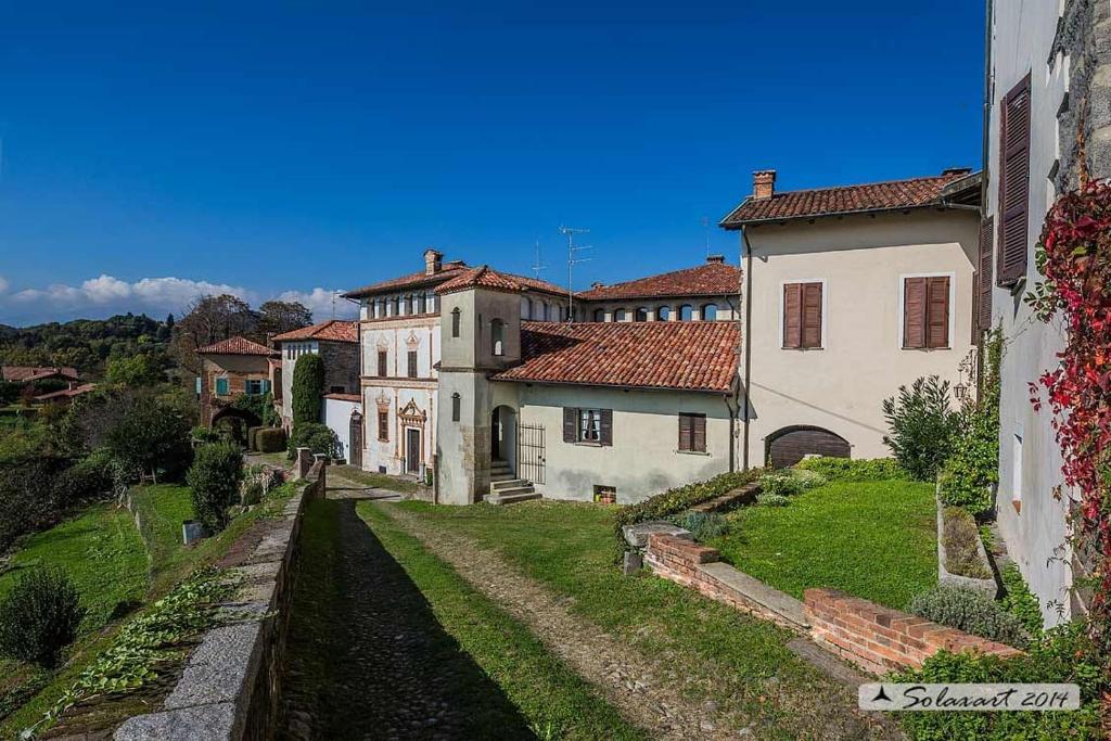 a group of buildings sitting on top of a hill at Al Castello di Valdengo in Valdengo