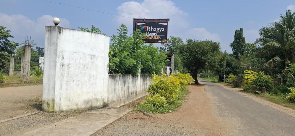 a sign on the side of a road at Bhagya Resort Limited in Nikawatawana