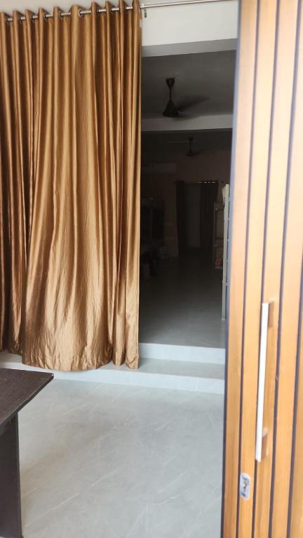 a room with a curtain and a room with a floor at My own dormitory in Cochin