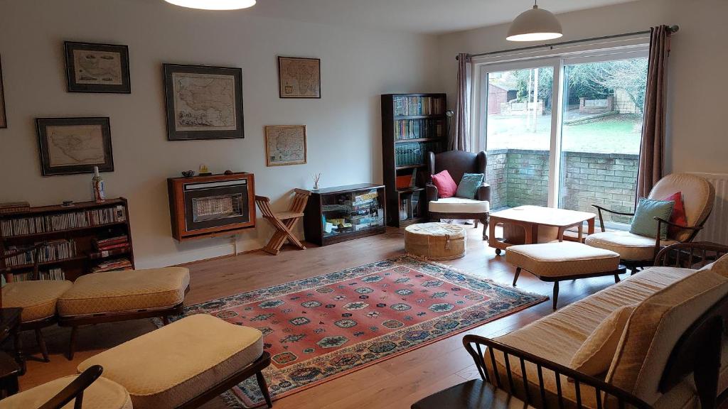 a living room with a couch and a fireplace at Gidansu in Penrith