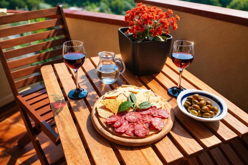 a wooden table with a pizza and two glasses of wine at Casa Vacanze Paola 2 in Santa Luria