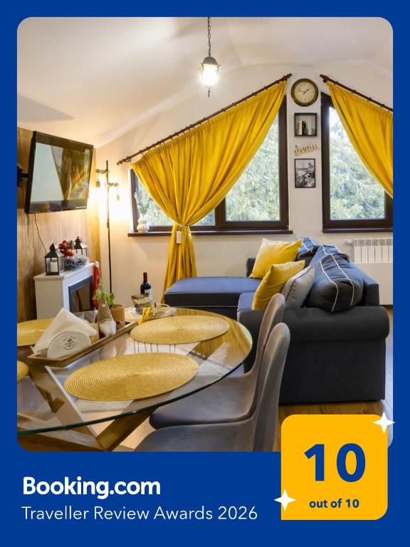 a living room with a couch and a table at Borovets Dream Studio in Borovets