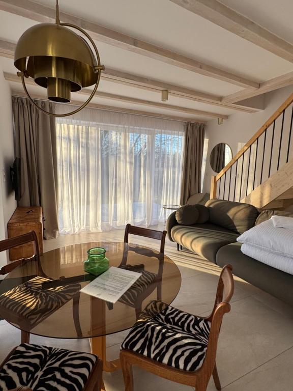 a living room with a couch and a table at Białe Tarasy in Rogowo