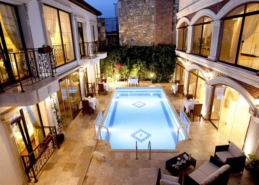 an overhead view of a swimming pool in a building at Saint John Hotel in Selcuk