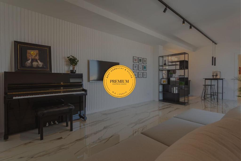a living room with a piano and a couch at Wanderlust Experience Zenith Rooftop in Bitonto