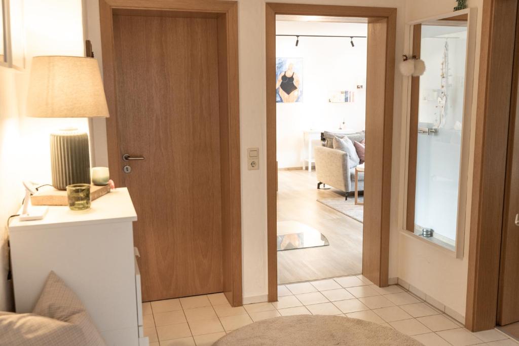 a living room with a door leading to a living room at Hohenlupfenblick in Stühlingen