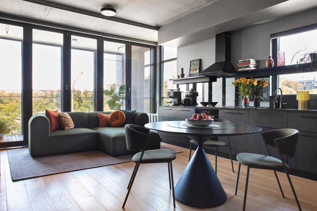 a living room with a couch and a table at Eastlake Retreat Kingston in Kingston 