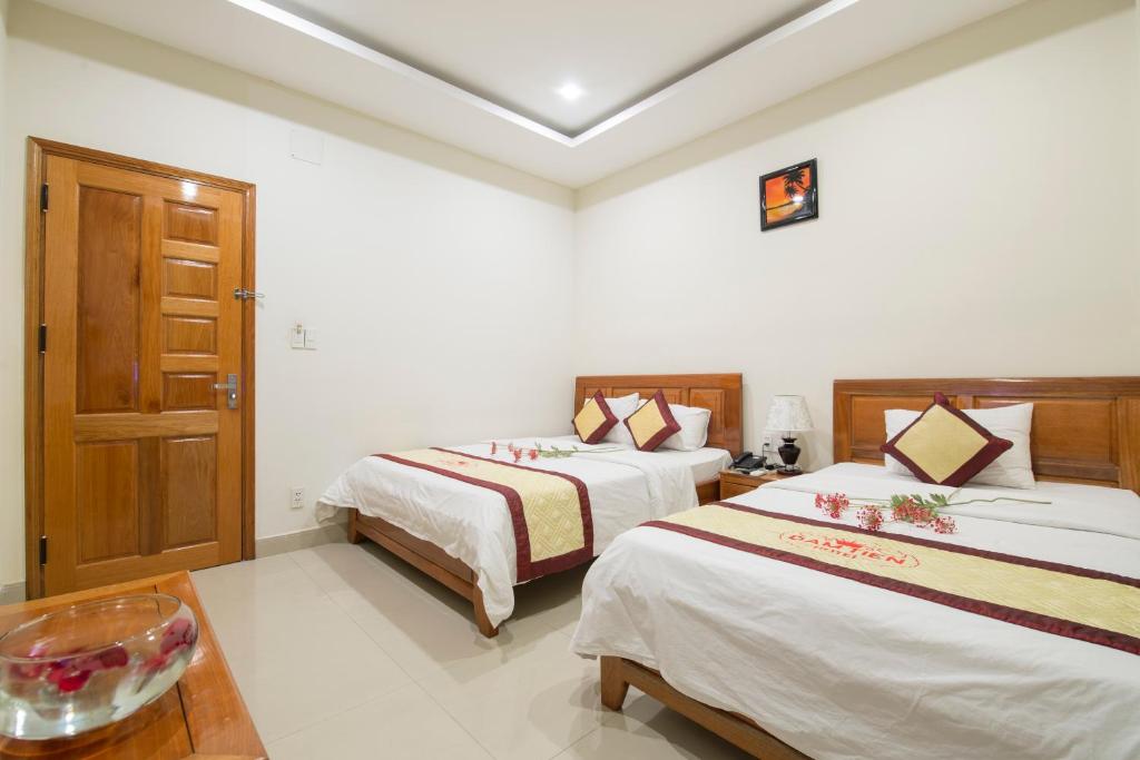Postel nebo postele na pokoji v ubytování Dam Tien Hotel