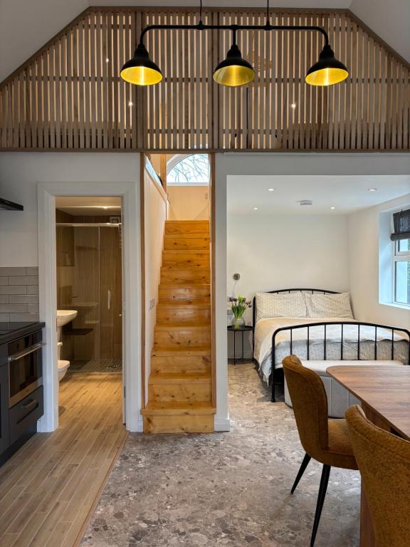 a room with a staircase leading to a bedroom at Stable Lodge in Killarney