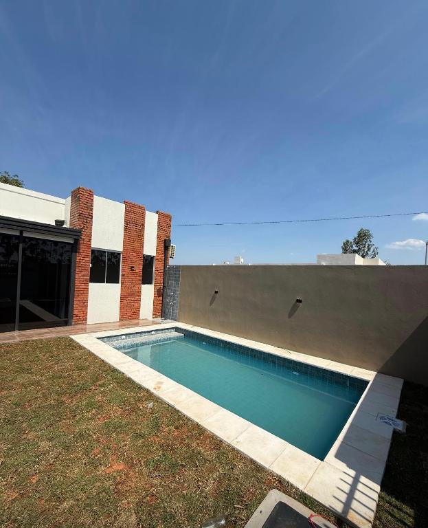 a swimming pool in the backyard of a house at La casita de Ivanna in San Bernardino