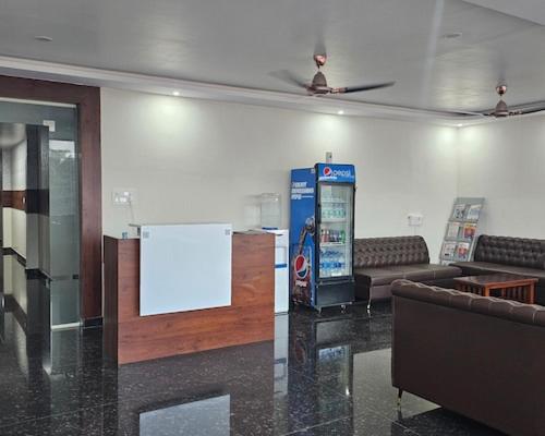 a lobby with a drink machine in a room at New KR Inn in Mālūr