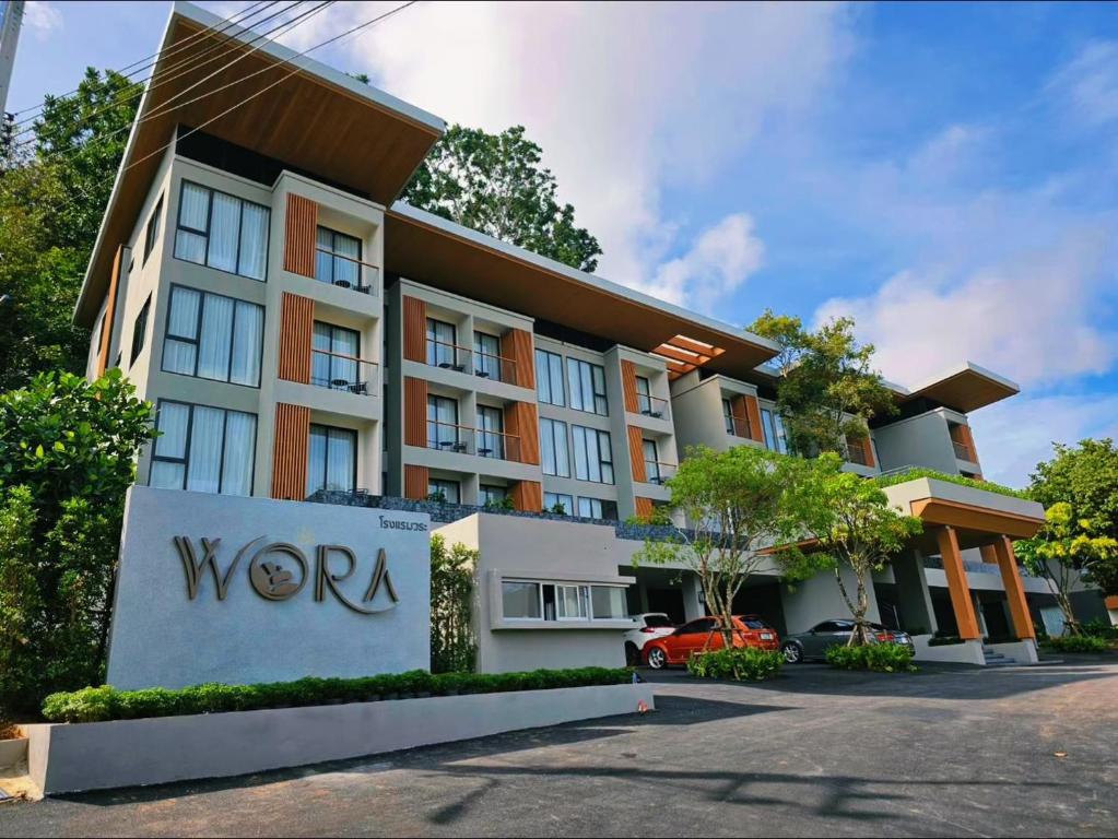 a building with awwa sign in front of it at Wora Phuket in Ban Sam Kong