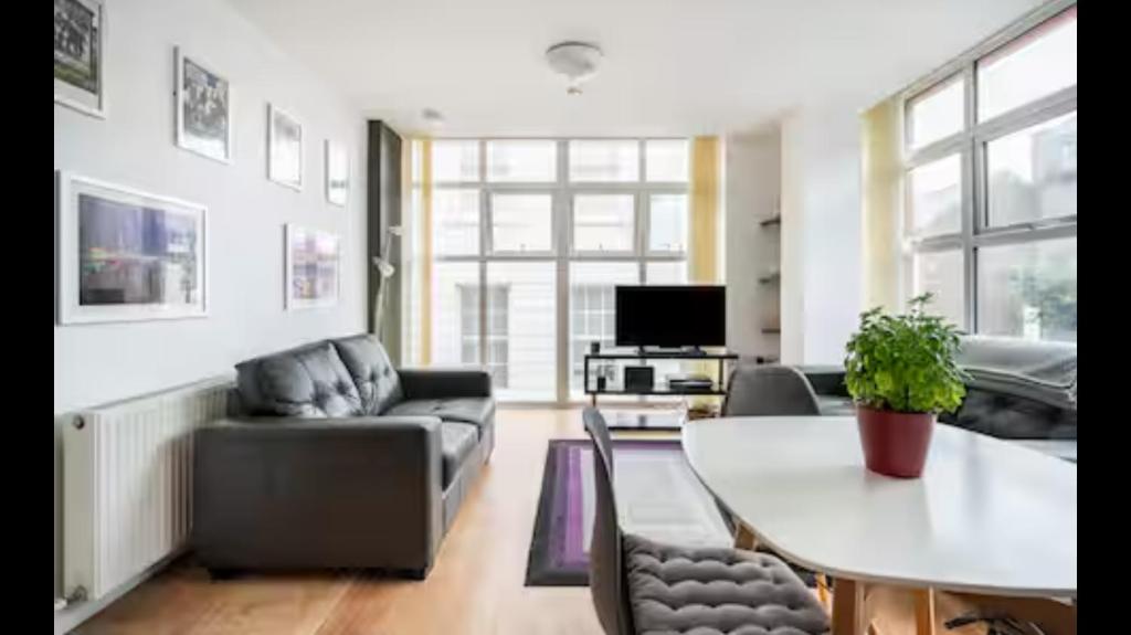 a living room with a table and a couch at ApartmentA in Derry Londonderry