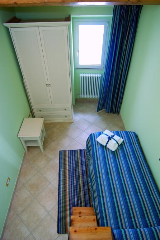 Postel nebo postele na pokoji v ubytování La Casetta Di Atri
