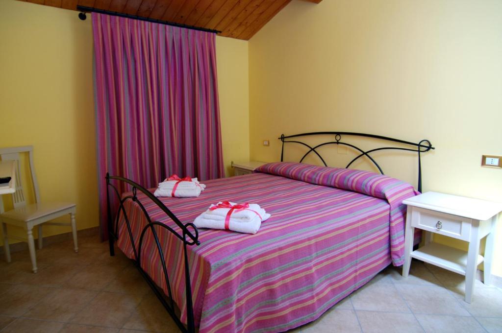 Postel nebo postele na pokoji v ubytování La Casetta Di Atri