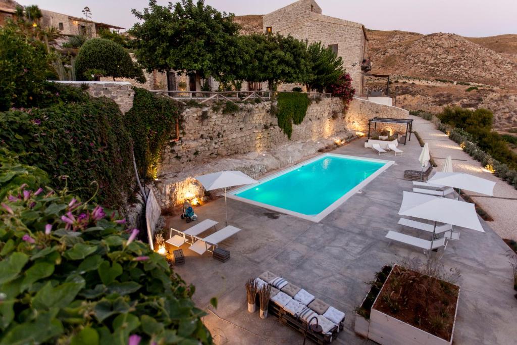 an overhead view of a swimming pool in a yard at Masseria Agnello in Realmonte