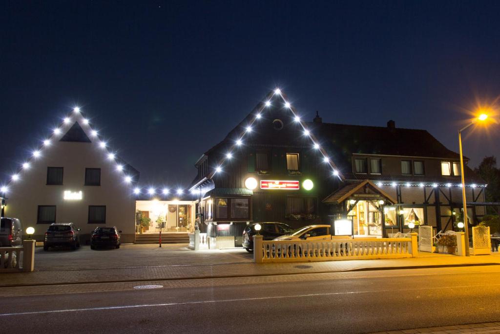 a building with christmas lights on it at night at Hotel Kaiserquelle in Salzgitter