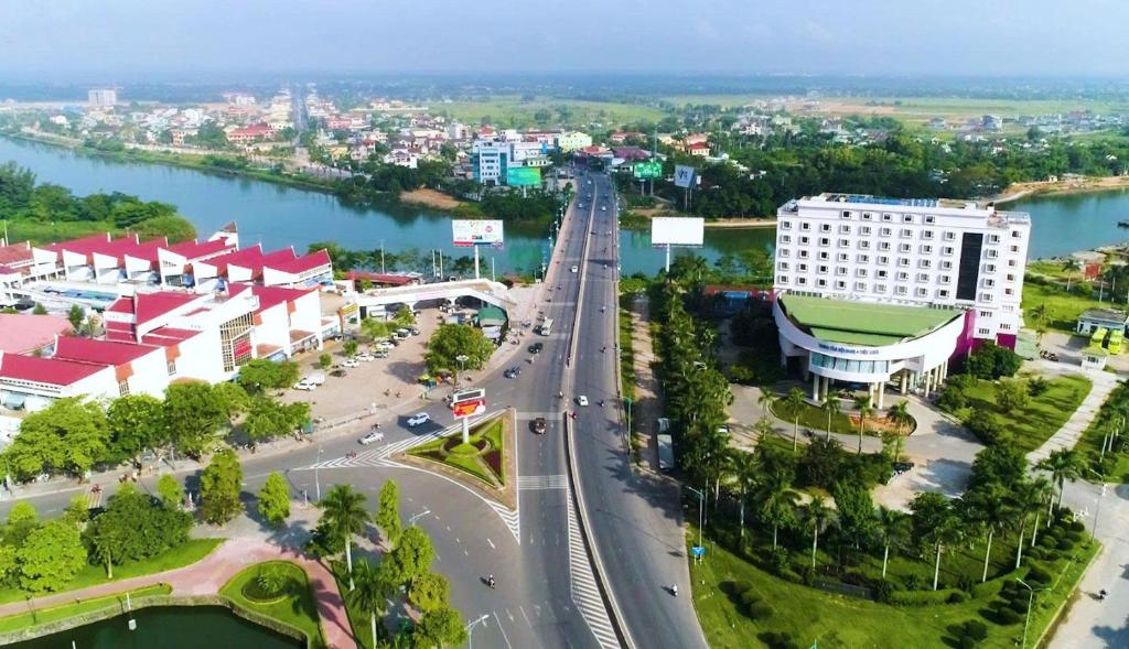 an overhead view of a city with a road and buildings at Sai Gon Dong Ha Hotel - a member of Saigontourist Group in Quang Tri