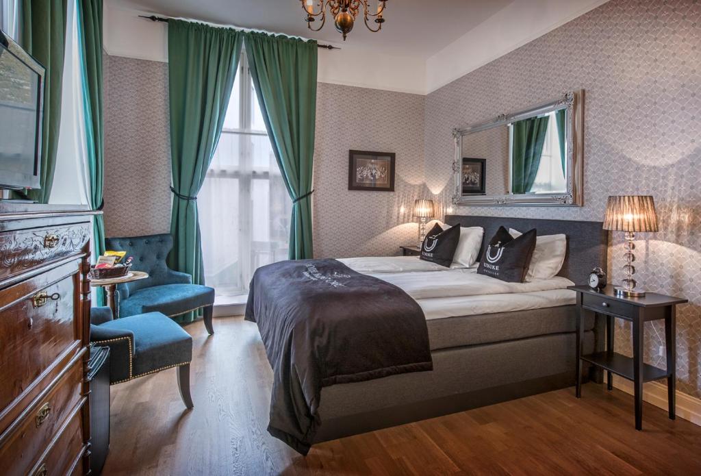 Postel nebo postele na pokoji v ubytování Hotel Kong Carl - Unike Hoteller