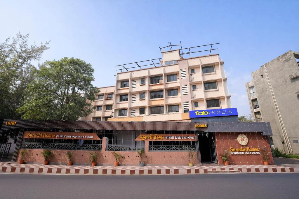 a building with a sign that reads mills at FabHotel Suruchi Homes in Vasai