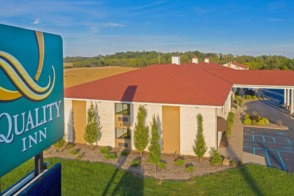 a building with a sign in front of it at Quality Inn Milan-Sandusky in Milan