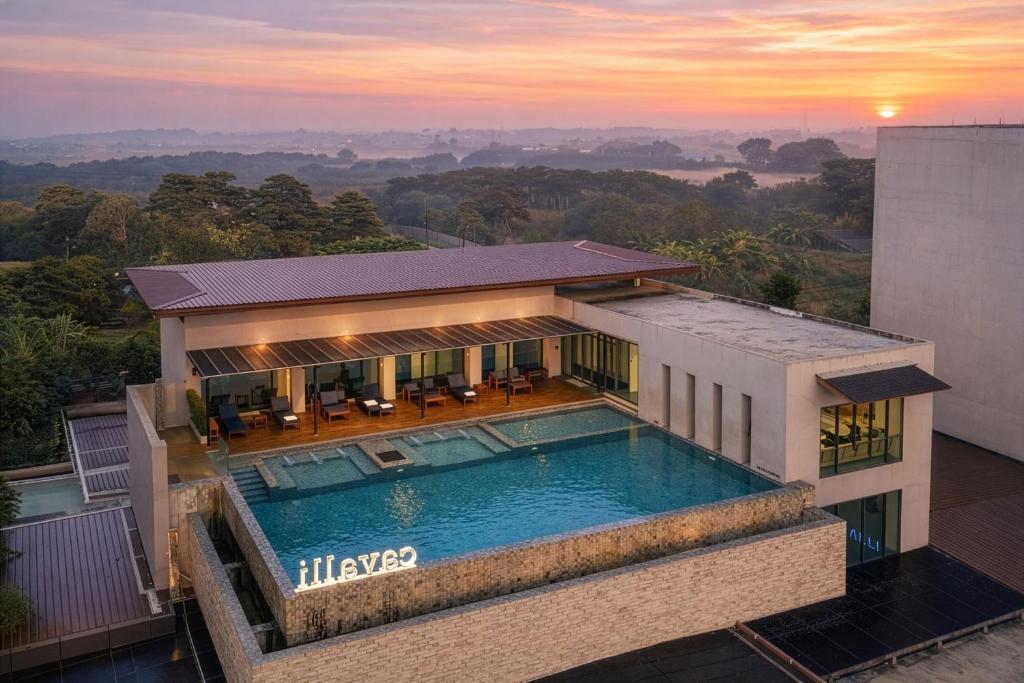 an aerial view of a house with a swimming pool at The Cavalli Casa Resort in Phra Nakhon Si Ayutthaya