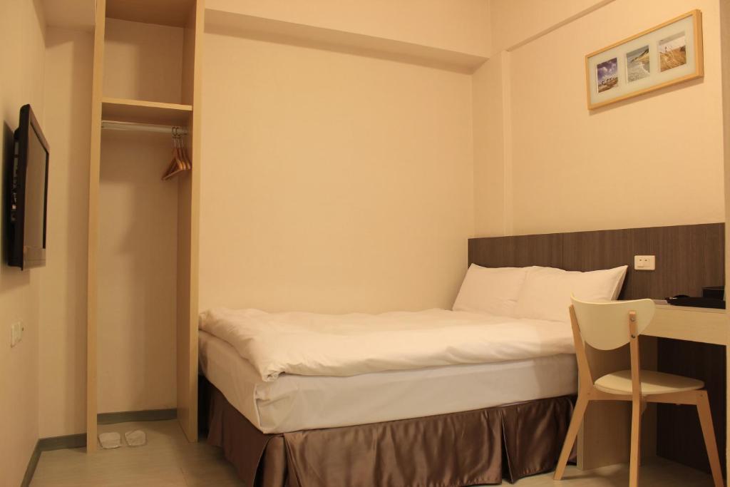 Postel nebo postele na pokoji v ubytování Sunnyside Hotel