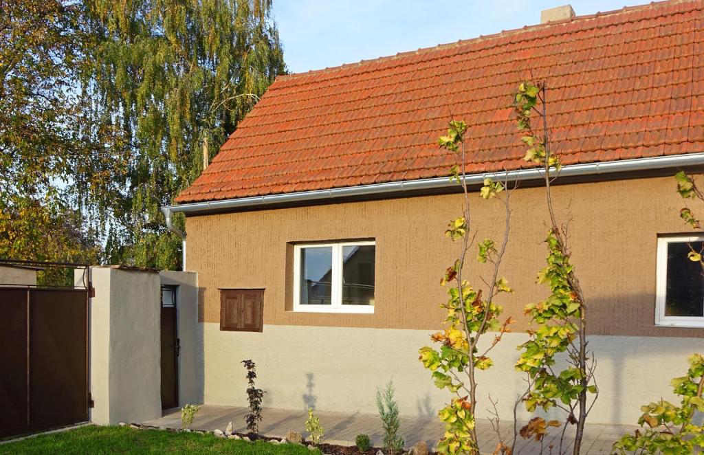 a brick house with a red roof at Chalupa Kdovíkde in Budyně nad Ohří