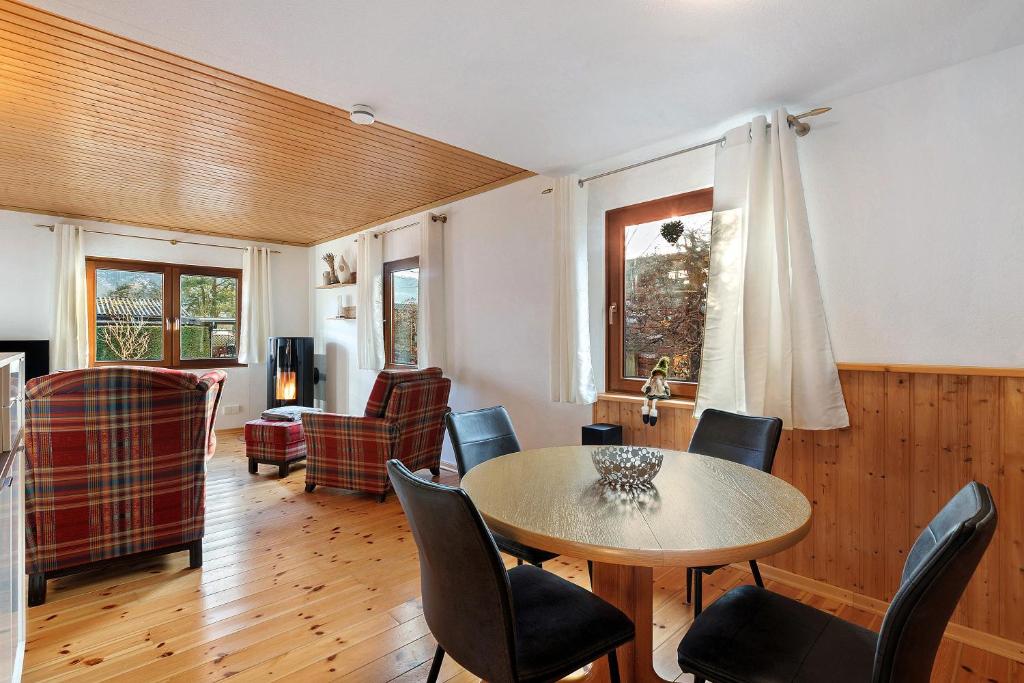 a living room with a table and chairs at Frenkhausener Ruhepol in Meschede