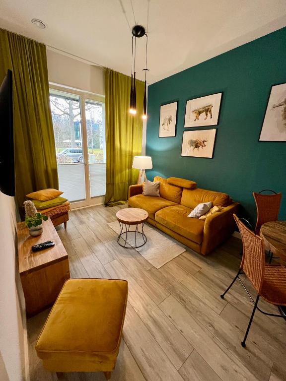 a living room with a couch and a table at Nieznany Bór 8 in Hajnówka