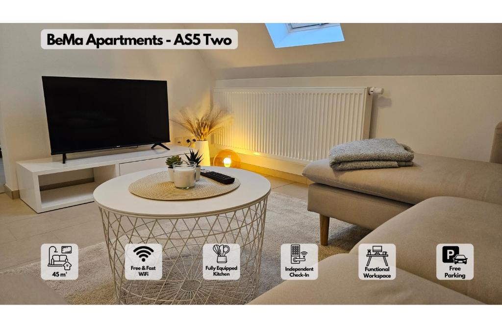 a living room with a tv and a table at AS5 Two Hallstadt - Gäste-Favorit - Modern, Ruhig & 5 Min zum Zug nach Bamberg - BeMa Apartments in Hallstadt