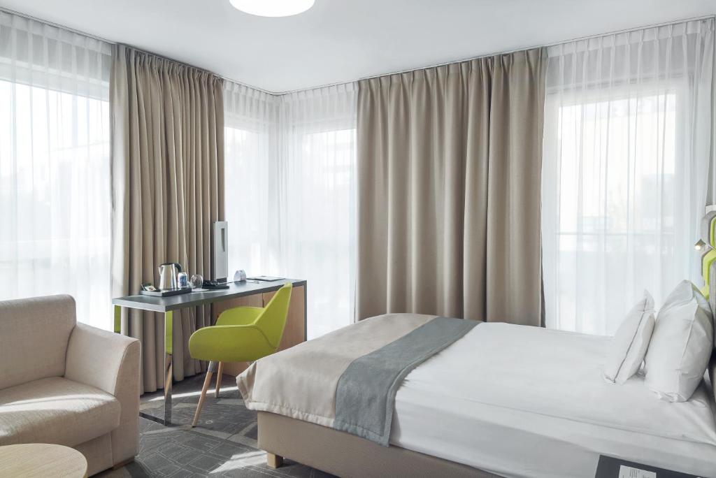 Posteľ alebo postele v izbe v ubytovaní HOTEL ALMOND BUSINESS & SPA BY GRANO - GRANO HOTEL Gdańsk Riverside