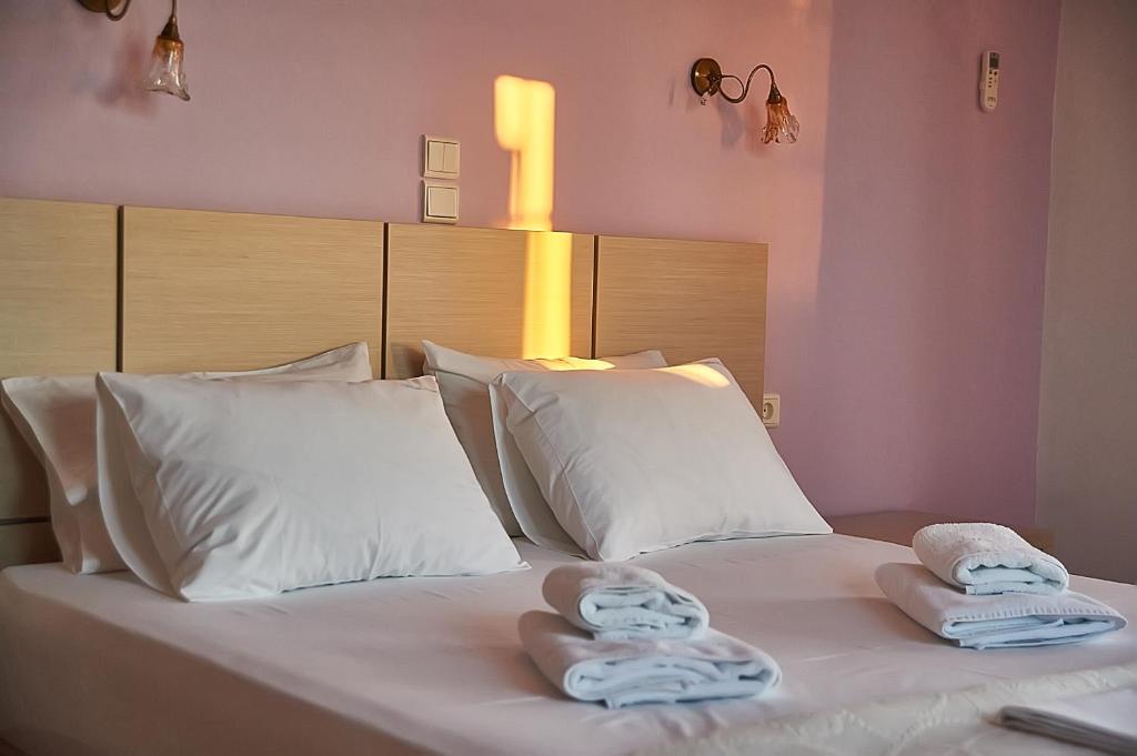Postel nebo postele na pokoji v ubytování Villa Aroni