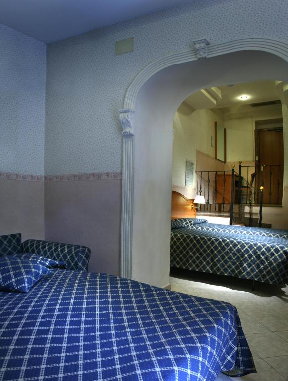 Uma cama ou camas num quarto em Hotel Delle Muse