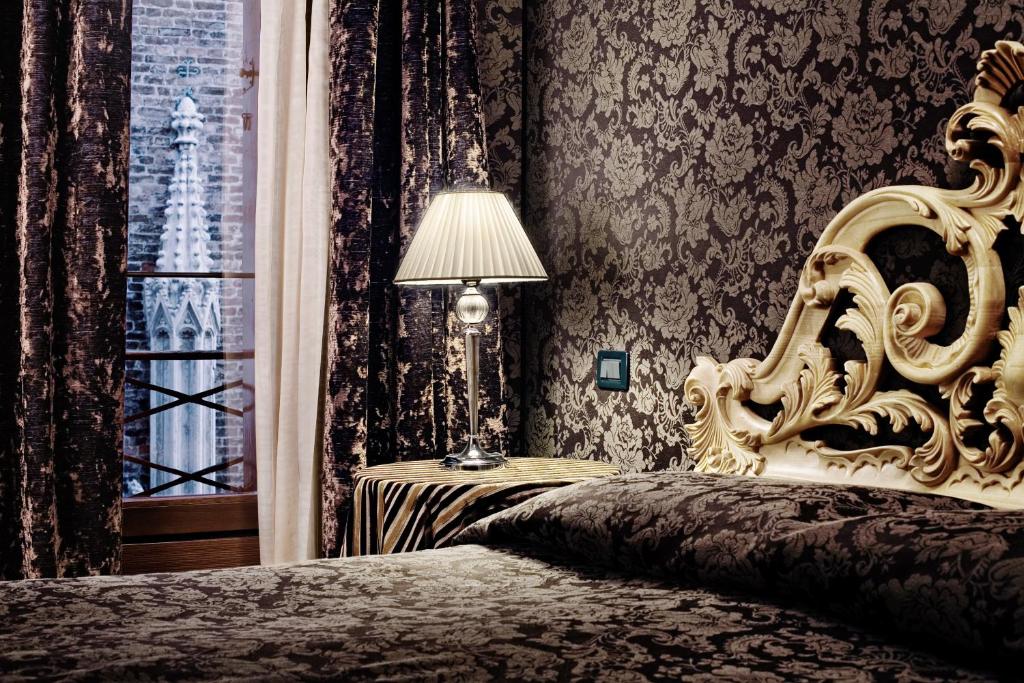 Postel nebo postele na pokoji v ubytování B&B Bloom Settimo Cielo