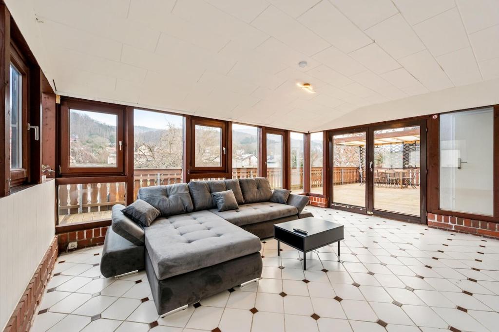 a large living room with a couch and a table at KS01 Monteurwohnung mit Ausblick! in Alsbach-Hähnlein