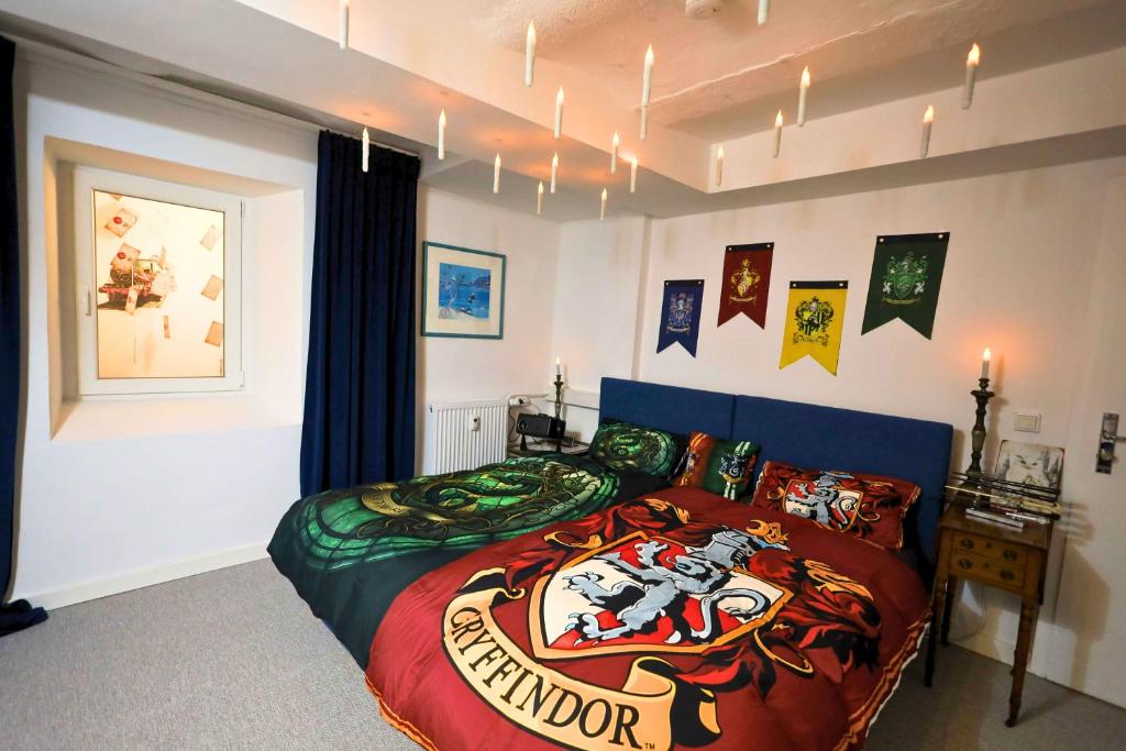 a bedroom with a bed with a spider man bedspread at FeWo JoJo am Luegsteinsee mit traumhaftem Kaiserblick in Kiefersfelden